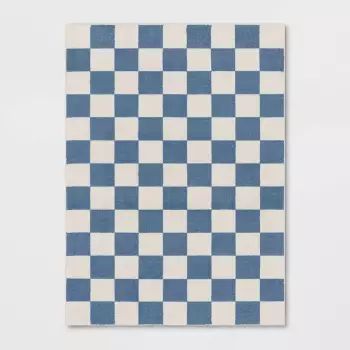 a blue and white checkerboard pattern on a wall