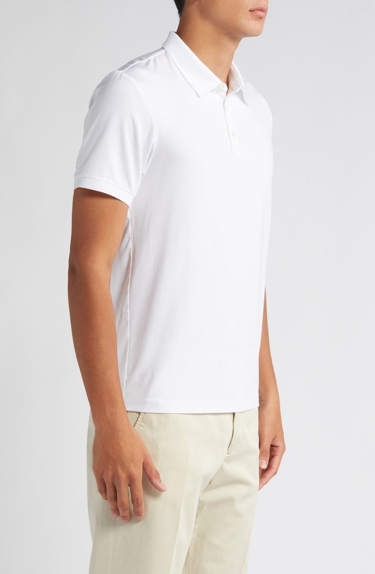 This polished take on the polo is crafted from lightweight lyocell jersey with added stretch to retain its shape. 26" length (size medium) Button half-placket Spread collar Short sleeves 93% Tencel® lyocell, 7% spandex Tencel lyocell is a sustainably produced fiber made with closed-loop processing Dry clean or machine wash, tumble dry Imported Casual White Stretch Polo Shirt, White Casual Polo Shirt With 4-way Stretch, White Casual Polo Shirt With Seamless Collar, Casual White Polo Shirt With Seamless Collar, Stretch Cotton Collared Polo Shirt, White 4-way Stretch Polo Shirt, Fitted Spring Polo Shirt, Collared Top With 4-way Stretch For Golf, Collared Tops With 4-way Stretch For Golf