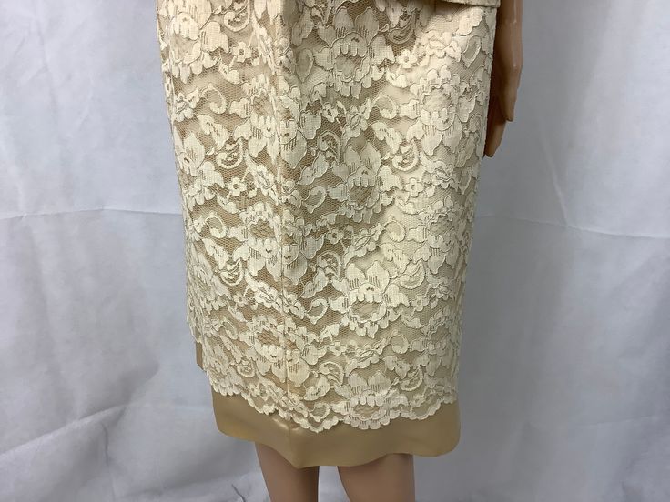 "No tags, possibly handmade Beautiful ivory/beige lace over satin jacket and skirt set is perfect for a wedding or vow renewal Measurements are approximate and taken laying flat, double where appropriate Skirt 13.5\" waist (27\" doubled) 19\" hips (38\" doubled 26\" length Jacket 19\" chest armpit to armpit 19\" waist 17\" sleeve length 23\" length center back collar to hem The snap is missing for the bow, see pictures and the loop for the hook at the collar could be tightened Small spot on righ Elegant Beige Scalloped Lace, Elegant Cream Lace For Spring, Elegant Fitted Lace For Vintage Events, Elegant Spring Wedding Lace, Spring Wedding Elegant Lace, Elegant Cream Scalloped Lace, Beige Lace For Spring Wedding, Spring Wedding Beige Lace, Fitted Cream Lace For Party