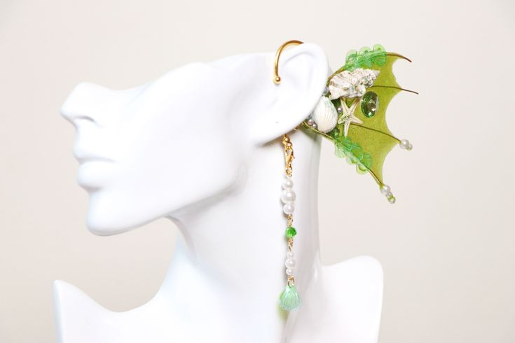 Elven Ear Cuffs - This is a way to look and feel like a Fairy or an Elf! No need for piercing your ears or gluing those latex fake ears on to your skin! 【Please do not use force to bend the earing】Slowly and gently try to slip on the ear. If excessive force is use it can break. *Color is mixed every time an earring is being made. Color might not be exactly as the photo but will try my best to replicate the same exact color Emerald Green color Fin, Shell, Gold mental Bend Cuffs to resize The pend Handmade Fantasy Body Jewelry For Party, Adjustable Fantasy Style Party Ear Cuff, Adjustable Fairycore Jewelry For Parties, Handmade Fantasy Body Jewelry For Festivals, Handmade Fantasy Style Jewelry For Parties, Handmade Fantasy Jewelry For Party, Whimsical Adjustable Ear Cuff For Festivals, Fairycore Jewelry For Parties, Whimsical Adjustable Ear Cuff As Gift