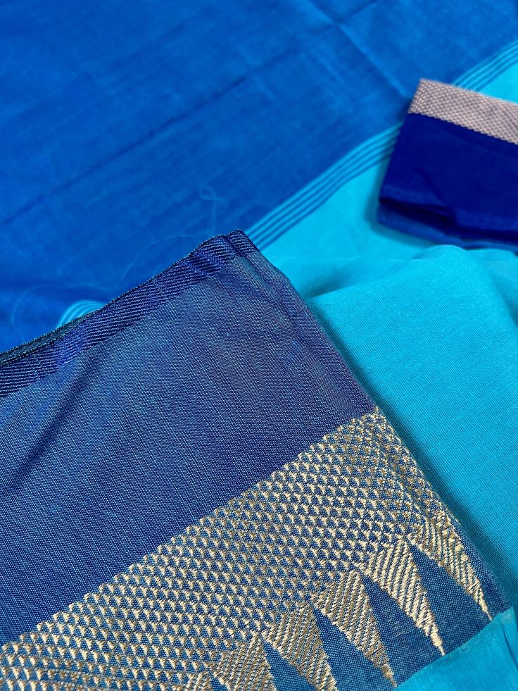 Beautiful Handloom Saree different shades of Ocean Colors (Blue) with Temple Borders with Muted Zari Weave. Saree in Pure Khaadi Handloom Cotton. Item : SareeColor : BlueBase Fabric : Pure Khaadi Handloom Cotton. Blouse piece : Comes with un-stitched Blouse piece.Blouse material : Pure Khaadi Handloom Cotton. Work : Handloom SareeFall & Edging : Comes with Fall and edging (Pico) done and Tassels attached Disclaimer -:- Color variation is possible due to various reasons like phone or desktop sett Blue Pre-draped Saree With Zari Weaving For Navratri, Blue Pre-draped Saree With Zari Work For Festivals, Traditional Blue Pre-draped Saree With Dupatta, Traditional Blue Pre-draped Saree With Self Design, Traditional Blue Pre-draped Saree For Festivals, Festive Blue Handloom Pre-draped Saree, Festive Blue Art Silk Pre-draped Saree, Blue Pre-draped Saree With Zari Weaving, Bollywood Style Blue Pre-draped Saree