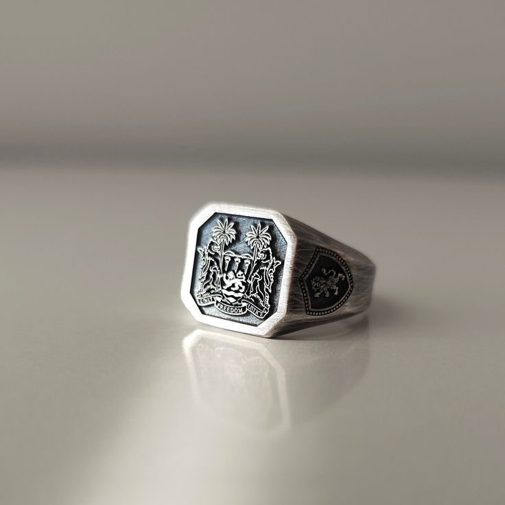 Family Crest/Graduation Ring PRODUCT DETAILS * Material: 925 Sterling Silver * Surface diameter width 17mm, * Medium Weight appx 12 grams. * Finish: Silver Oxidized Personalized and Customized Solid 925 Sterling Silver Signet Ring. Your family crest, university logo or any image you want can be engraved. There is no extra charge for engravings on the side arms of the ring. ---All items are nicely packaged ready to gift in wooden jewelry boxes.--- PROCESSING & SHIPPING * All items purchased will Classic Formal Skull Ring With Polished Finish, Luxury Silver Initial Open Ring, Luxury Silver Open Initial Ring, Luxury Sterling Silver Dome Promise Ring, White Gold Polished Skull Ring Gift, White Gold Skull Ring With Polished Finish Gift, Luxury Silver Open Ring With Initial, White Gold Skull Ring With Polished Finish, Engraved Open Skull Ring As Gift