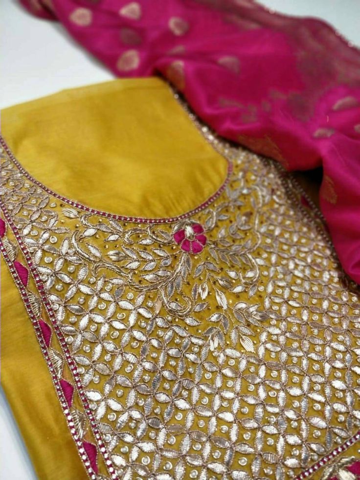 Item Overview ATHARVA Hand Embroidery Salwar Kameez/Embroidery Neck Yellow/Banarsi Silk Dupatta/Custom Stitch/Tunic/Patiala/Churridar/Anarkali Dno. CH1510 Fabric: * Shirt - Chanderi Silk- Hand Embroidered Neck - Yellow- 2.5 Mts - Beautiful Hand Embroidery * Dupatta: Chiffon Chinnon Dupatta- All over Embroidery - 2.5 Mts- Latkans Tassels - Dark Pink * Bottom Santoon Silk 2.5 Mts. Excusive Hand Embroidered Party Wear Punjabi Suit. Customization: * Fabrics Customization: Designs Can be made in diff Anarkali Churidar With Mirror Work, Anarkali Churidar With Mirror Work And Straight Kurta, Churidar With Zari Work For Navratri, Transitional Gold Sharara With Dori Work, Anarkali Chinon Churidar With Gota Work, Anarkali Traditional Wear With Mirror Work In Dola Silk, Eid Kurta With Multicolor Embroidery And Mirror Work, Yellow Raw Silk Kurta With Dori Work, Navratri Churidar With Zari Work Chandbali Shape