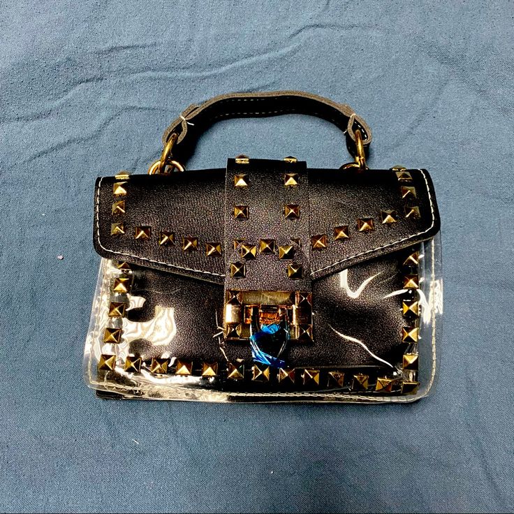 Faux Leather And Vinyl Purse With Studs And A Chain. 7.5” Length And About 5” Height Buzz Lightyear Backpack, Vinyl Purse, Louis Vuitton Wristlet, Black Evening Bag, Faux Leather Purse, Mini Bucket Bags, Brown Purses, Vintage Purse, Leather Bag Women