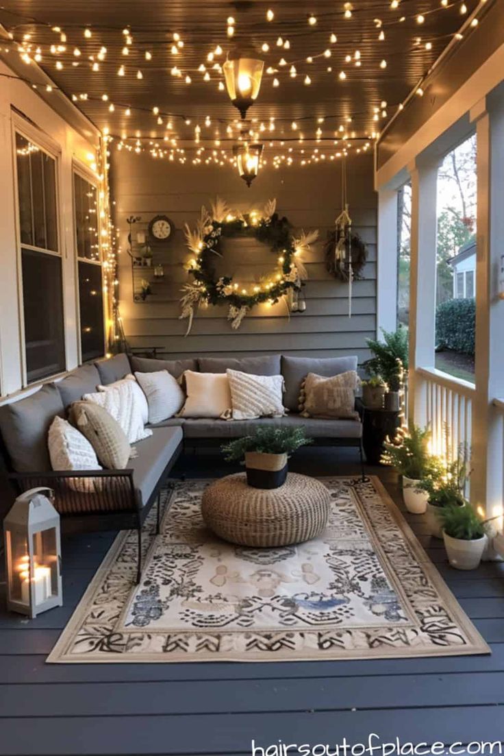 a porch covered in lights and furniture