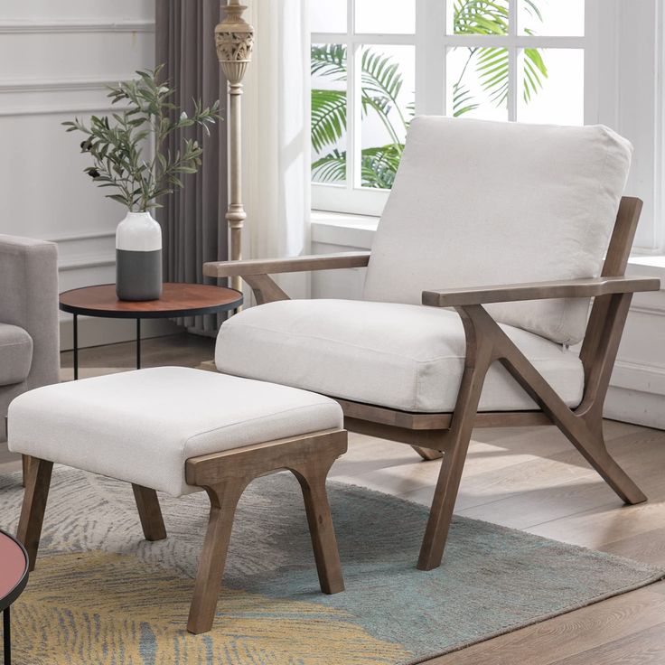 a chair and ottoman in a living room