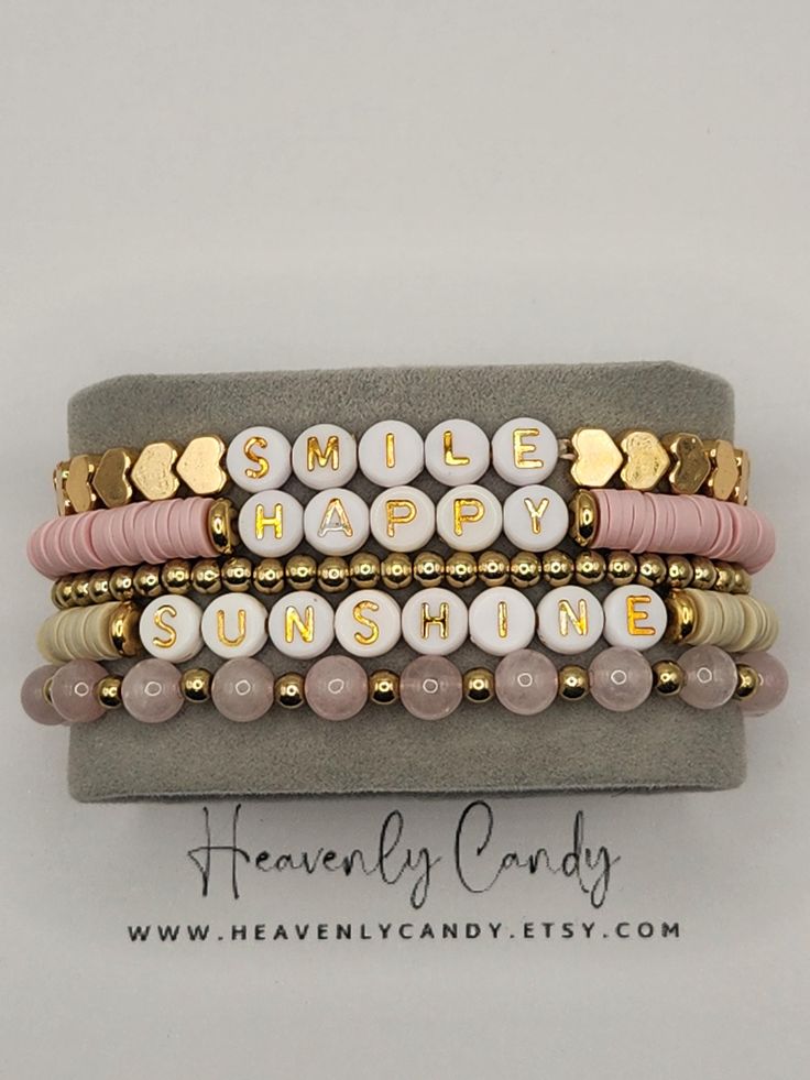 5 stack faith-based pink and gold bracelets. Bracelets arrive in a cello bag which is placed into a blush-colored gift bag, ready for giving Inspirational Pink Beaded Jewelry, Personalized Pink Bracelets For Everyday Wear, Inspirational Gold Beaded Bracelets As Gift, Inspirational Gold Beaded Bracelets For Gift, Inspirational Pink Beaded Bracelets As Gift, Pink Stackable Jewelry For Mother's Day, Gold Inspirational Beaded Bracelets As Gift, Personalized Pink Bracelets For Everyday, Pink Friendship Bracelets For Mother's Day