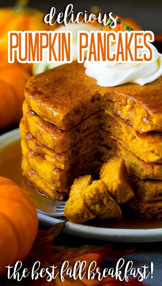 stack of pumpkin pancakes with whipped cream on top and text overlay that reads delicious pumpkin pancakes the best fall breakfast