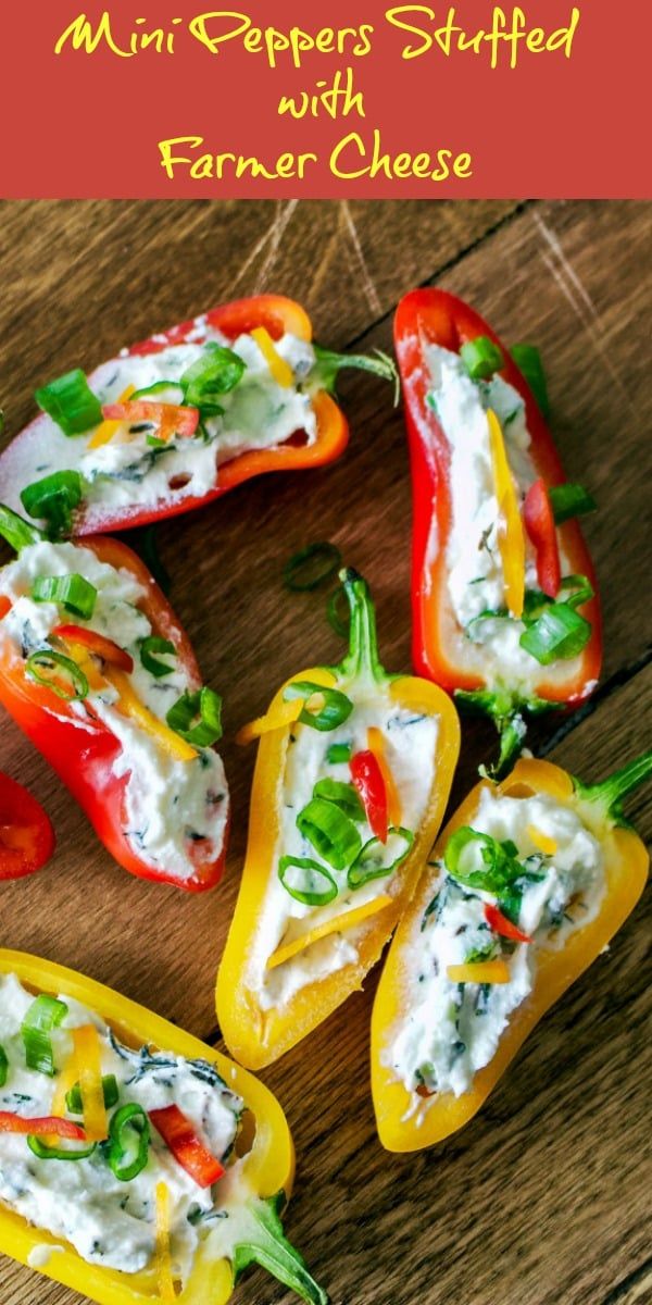 mini peppers stuffed with ranch cheese on a cutting board