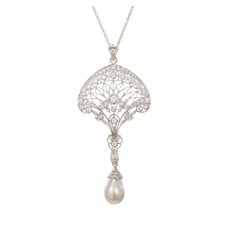 Edwardian Pearl and diamond open work pendant necklace. Platinum filigree pave set diamonds. Iridescent silvery South Sea semi-precious baroque pearl with rolling tints of both greenish blue and pink. The bail on the pearl opens. It can be removed from the pendant to wear either the pearl or the pendant without one another. Platinum chain. 1 Baroque South Sea pearl. Shape: 10.5mm x 17mm 64 round diamonds approx. total weight 1.90cts, F, VS Platinum Tested Platinum 20.3 grams Length of Chain: 16 Classic Silver Baroque Necklace, Exquisite White Filigree Necklace, Exquisite White Filigree Necklaces, Formal Diamond Filigree Necklace, Drop Pearl Pendant Jewelry For Evening, Elegant Filigree Jewelry In Diamond White, Luxury Baroque Pearl Necklace For Wedding, Luxury Silver Pear-shaped Diamond Necklace, Elegant White Gold Briolette Diamond Necklace