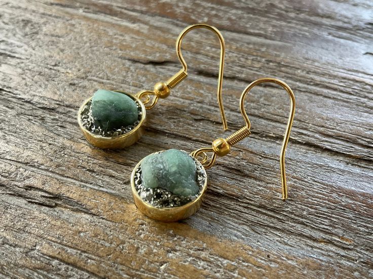 Raw Emerald and Pyrite Dangle Earrings/Dime Size/Gold or Silver Silver Brass Earrings With Gemstone, Silver Gemstone Brass Earrings, Gold Dangle Earrings With Birthstone, Handmade Dainty Gold Crystal Earrings, Gold Spiritual Drop Crystal Earrings, Gold Gemstone Crystal Earrings As Gift, Gold Crystal Gemstone Earrings As Gift, Spiritual Gold Crystal Drop Earrings, Adjustable Gold Crystal Earrings Nickel Free