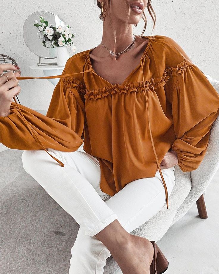 The EMES SHOP blouse is detailed with cute ruffle details. Features a tie neck. drop shoulder. solid color. and flowy fit. Pair it with palazzo pants and sunnies for a fantastic look.MATERIAL:100%Soft Poly MEASUREMENTS:Product Length 24"-26"in Small | Bust & Hem Width : 39"-41"in Medium| Bust & Hem Width : 41"-43"in Large| Bust & Hem Width : 43"-45"in X Large| Bust & Hem Width : 45"-47"in MEASUREMENTS:Product Length 60"-65"cm Small | Bust & Hem Width : 99"-104"cm Medium| Bust & Hem Width :104"-1