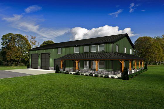 a large green house sitting on top of a lush green field