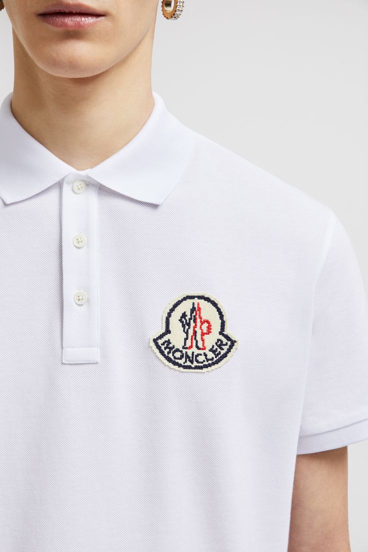 Appearing as a patch, this polo shirt reinterprets the logo as a pixelated design. The classic style is crafted from breathable cotton piquet with short sleeves. Cotton Polo Shirt With Logo Patch And Short Sleeves, Designer Short Sleeve Polo Shirt With Embroidered Logo, Casual Short Sleeve Polo Shirt With Logo Patch, Designer Collared Polo Shirt With Logo, Cotton Polo Shirt With Logo Patch, Casual Cotton Polo Shirt With Logo Patch, Casual Polo Shirt With Logo Patch, Collared Cotton Polo Shirt With Logo, Cotton Collared Polo Shirt With Logo