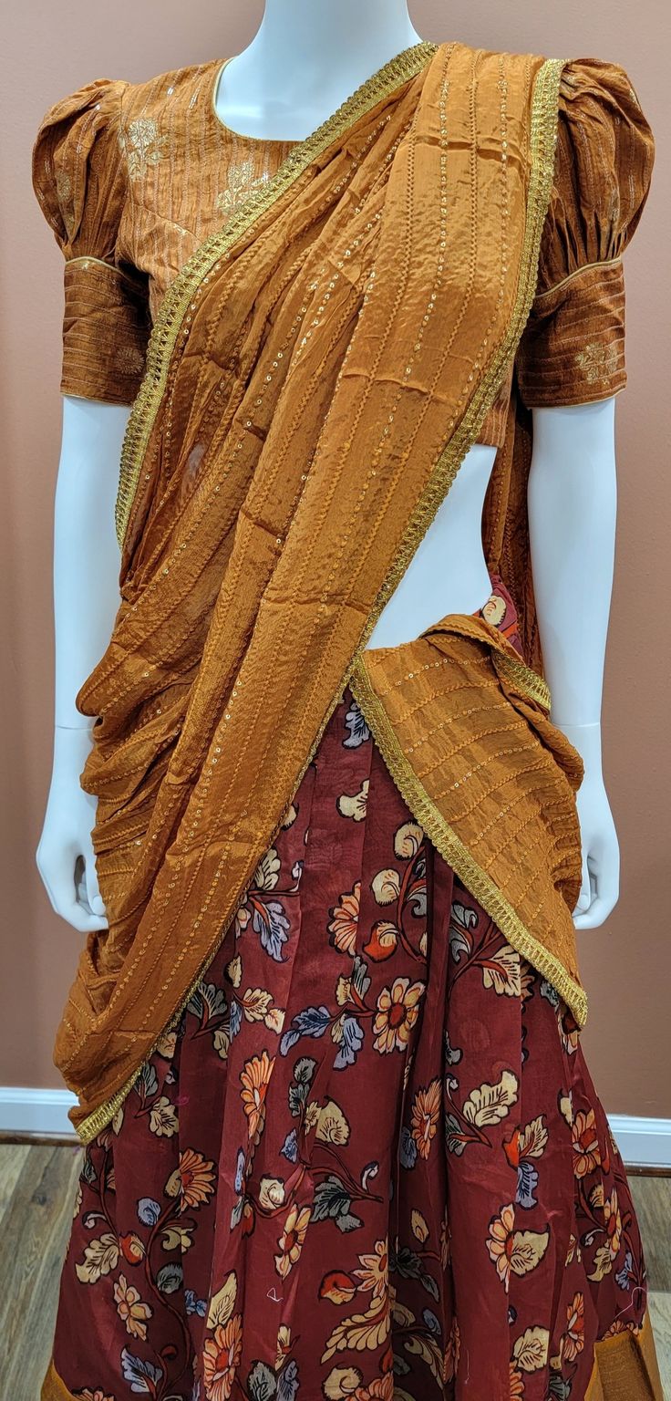 Eloquent Kalamkari Printed Banaras Half Saree set in Brown Blouse size : 32 Inches Lehenga length: 39 inches Brown Half Saree, Half Saree Blouse Designs, Half Saree Set, Traditional Dresses Designs, Brown Blouse, Lehenga Designs, Half Saree, Saree Blouse Designs, Saree Blouse