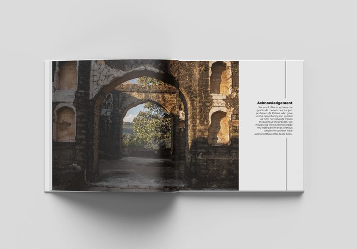 an open book showing the inside pages of a stone building with arches and doorways