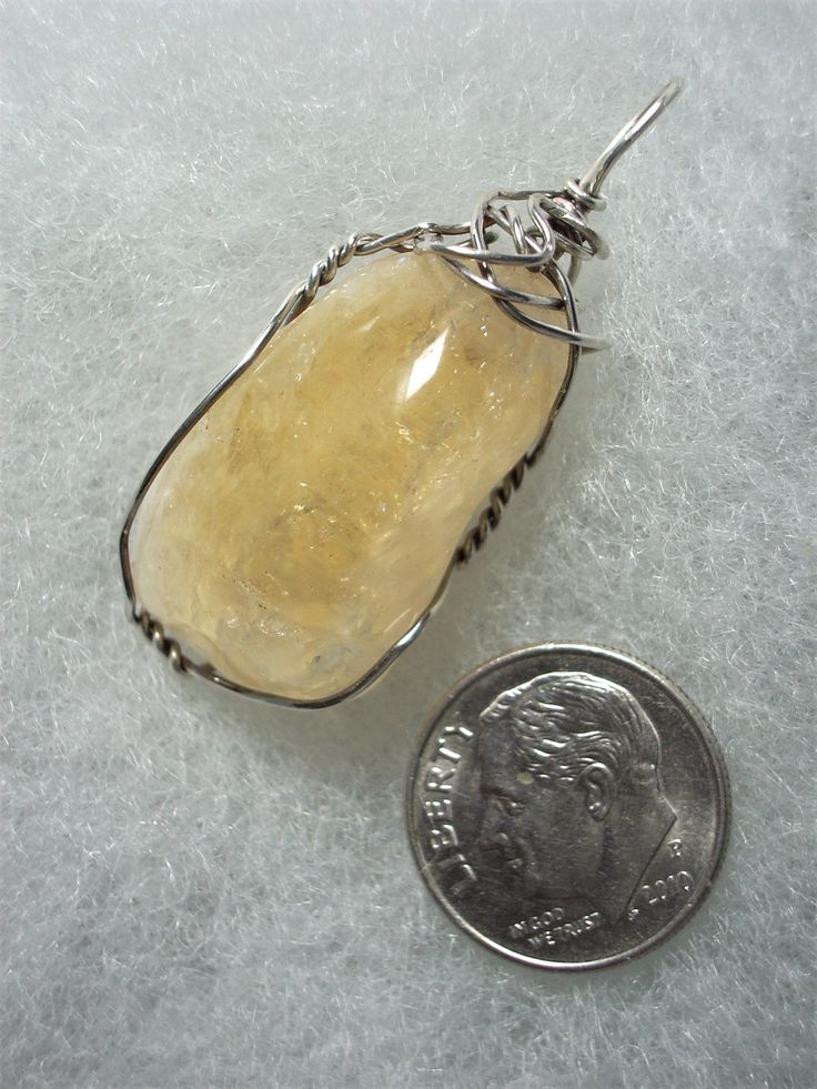 Citrine Pendant Wire Wrapped in .925 Sterling Silver Round Wire This enlightening stone provides a combination of golden yellow and clear crystal quartz with multiple internal reflective and iridescent fracture planes. It especially compliments maroon/burgundy, blue, purple, brown and beige/tan colored clothing; black and medium to dark grays are also nice. It also wears quite well with some shades of yellow and green (especially blue green). Avoid the light and bright colors of red, orange, yel Amber Citrine Gemstones For Gift, Large Round Citrine Stone Jewelry, Artisan Silver Citrine Jewelry, Round Citrine Jewelry With Large Stone, Artisan Amber Jewelry With Natural Inclusions, Polished Amber Citrine Jewelry, Amber Citrine Jewelry With Polished Finish, Sterling Silver Amber Jewelry With Large Stone, Sterling Silver Jewelry With Large Amber Stone