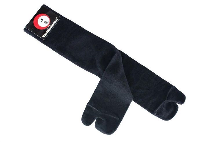 a pair of black gloves sitting on top of each other