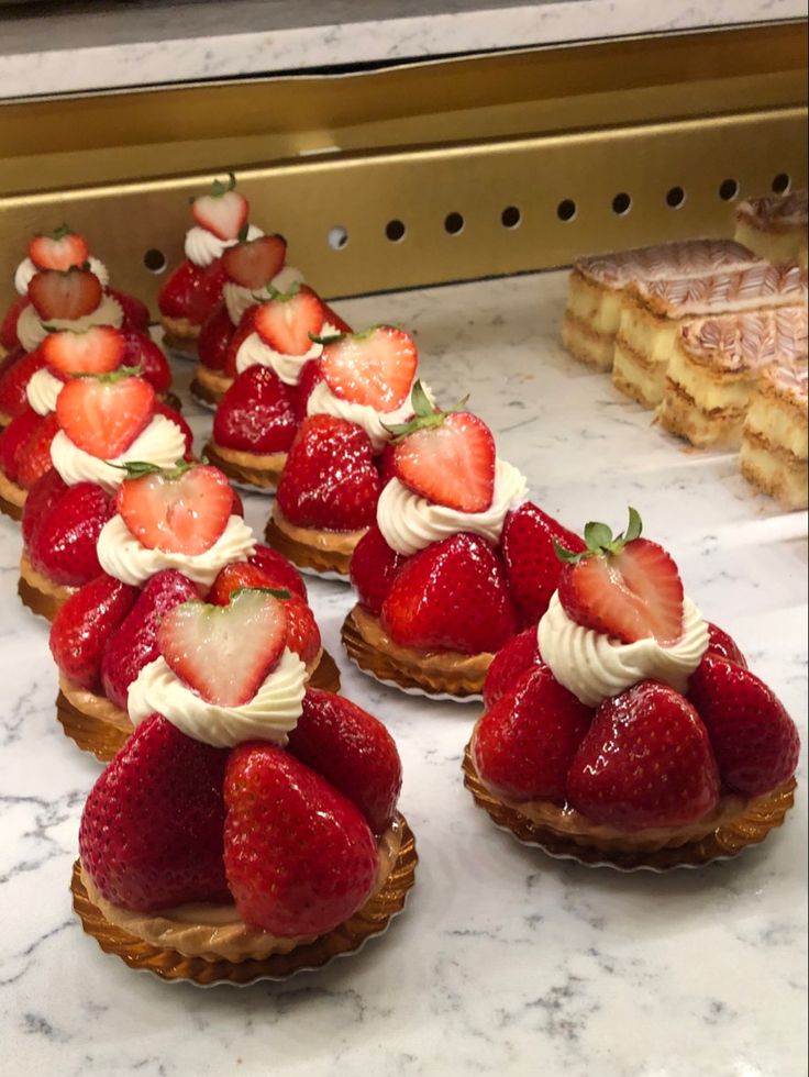 strawberries and other desserts are on display