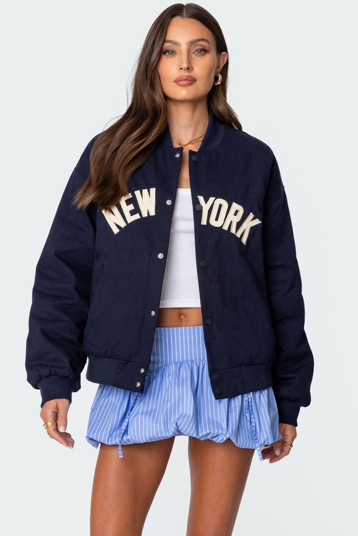 Urban Oversized Varsity Jacket With Pockets, Oversized Urban Varsity Jacket With Pockets, Oversized Casual Varsity Jacket With Pockets, Spring Varsity Outerwear For College, Varsity Outerwear For College In Spring, Sporty Spring Outerwear With Embroidered Logo, Oversized Long Sleeve Varsity Jacket With Pockets, College Style Cotton Outerwear With Embroidered Logo, Cotton Outerwear With Embroidered Logo For College