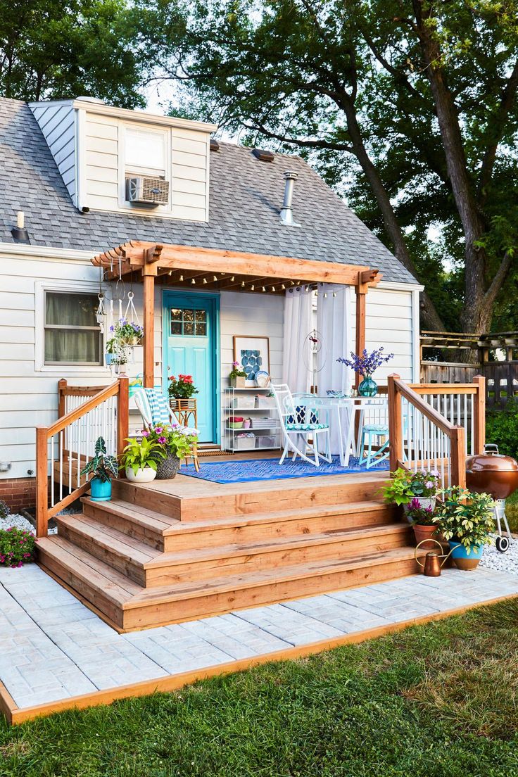 a porch with steps leading up to the front door