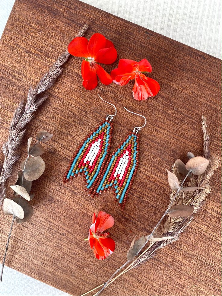 These native beaded earrings are made from selected Czech beads. Arrow seed bead earrings can be an excellent personalized gift for bridesmaids, Mothers Day, birthdays, Valentine's Day, Wedding day, Christmas, New Year, and for your loved ones. ♡ Length - 3'' (7.5 Centimeters) ♡ Width - 1'' (2.5 Centimeters) ♡ Quality Czech beads ♡ Stainless steel hooks/Silver 925 hooks If you like these fringe beaded earrings but would like them in a different color please email me and I do special orders. I ac Artisan Beaded Fringe Earrings As Gift, Artisan Beaded Fringe Earrings For Gifts, Traditional Beaded Tassel Earrings As Gift, Traditional Beaded Tassel Earrings For Gift, Beaded Fringe Teardrop Earrings As Gift, Artisan Beaded Tassel Earrings As Gift, Artisan Beaded Tassel Earrings For Gift, Earrings Boho Chic, Earrings Native American