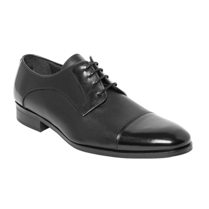 a man's black dress shoe on a white background