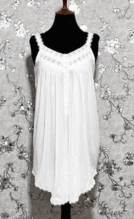 This gorgeous sleeveless Victorian nightgown is made entirely of cotton for the utmost in comfort and softness. It perfectly embodies the beauty and elegance of the Victorian era, embellished with exquisite lace accents. A hint of vintage charm can be added to your evening routine with this dreamy, timeless style created by the lightweight fabric and exquisite lace details. Elegant Cotton Summer Sleepwear, Elegant Summer Cotton Sleepwear, Elegant Cotton Sleepwear For Summer, Summer Sleeveless Nightgown With Lace Trim, Sleeveless Lace Trim Nightgown For Summer, Sleeveless Summer Nightgown With Lace Trim, Casual Sleeveless Nightgown With Lace Trim, Casual Sleeveless Lace Trim Nightgown, Cotton Nightgown For Spring Relaxation