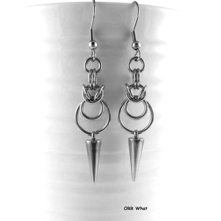 Double O Rings Earrings In Sturdy Stainless Steel, With Steel Spikes, Made With A Range Of Different Stainless Steel Hoops. Made By Hand, One Ring At A Time To To Create A Simple Yet Gothic Look. Steel Is Hypoallergenic And Anti Tarnish, Perfect For All Day Wear, No Irritation Or Green Skin. Rings Upon Rings, Make Your Statement. Very Comfortable To Wear. Ear Wires Are Standard Pierced Hooks With Rubber Stoppers, All Are Stainless Steel--Shorter Wires Are Possible, Plain Style Or Lever Back, Ple Jewelry Made From Nature, Metal Jewelry Tutorials, Metal Jewelry Handmade Creative, 24 Gauge Wire Jewelry, Metalhead Earrings, Cool Wire Jewelry, Diy Ear Rings, Edgy Round Metal Jewelry, Punk Hypoallergenic Dangle Jewelry