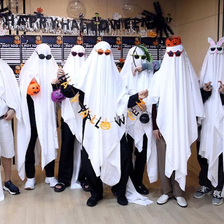 a group of people dressed up in halloween costumes