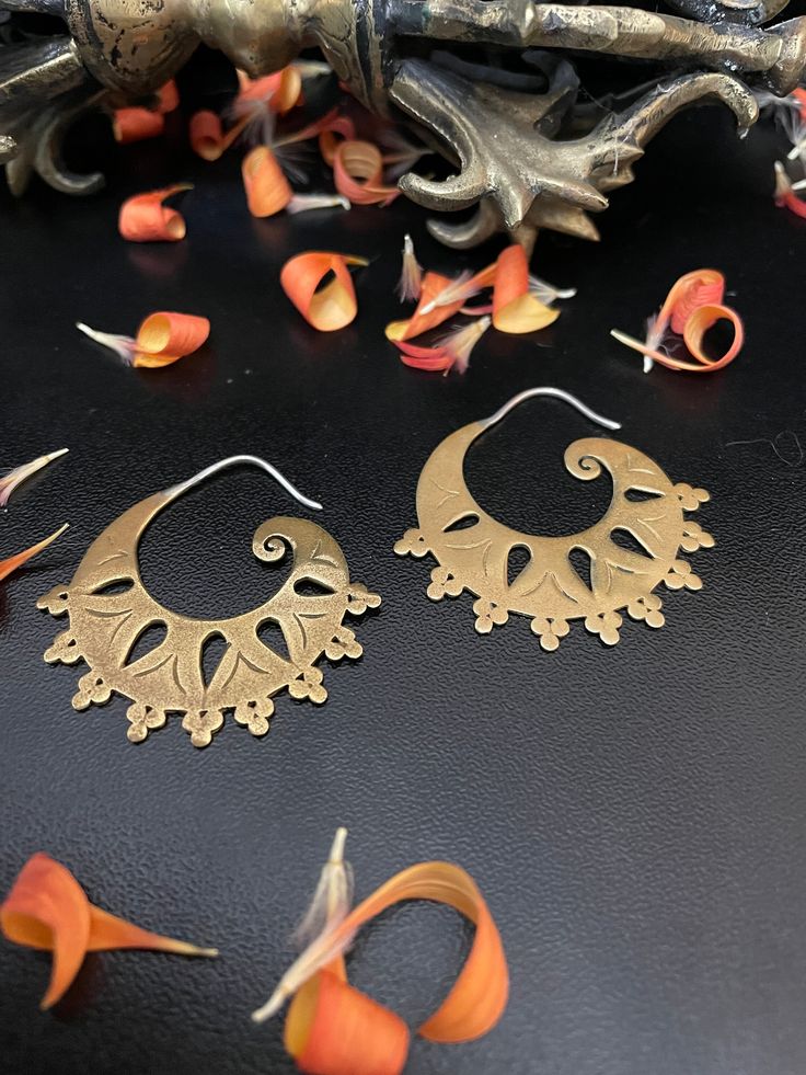 Hoop Earrings with cut-out Design, Brass, hinged clasp. Perfect for your Collection of accessories. Circumference: 1 1/4" Open studio most days from 10:00 to 5:00, DM, make an appointment to have an adventure in shopping. Yes ~ along with basic simplicity, It's all about you You deserve to know about my fabulous Treasure chest. Tribal Jewelry, Statement Piece Handmade Jewelry, Art to Wear, with Much Much More. Looking for more Treasures, Or would like to purchase, let your fingers do the shopping xoxo On My ETSY HeartbeatHandmade https://www.etsy.com/shop/HeartbeatHandmade Gold Hoop Earrings With Pierced Copper, Symbolic Round Pierced Hoop Earrings, Bronze Hoop Pierced Earrings, Artistic Metal Hoop Earrings Nickel Free, Artistic Nickel-free Metal Hoop Earrings, Symbolic Round Metal Hoop Earrings, Unique Metal Hoop Earrings, Pierced Copper Hoop Earrings, Small Hinged Hoop Earrings As Gift