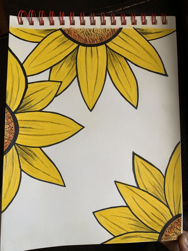 a drawing of yellow sunflowers on white paper