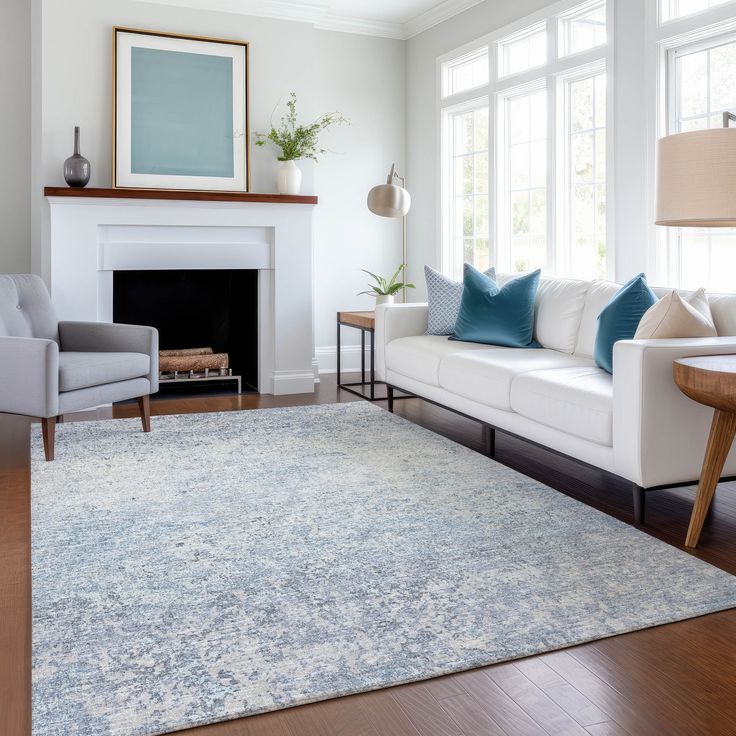 a living room filled with furniture and a fire place in front of a white fireplace