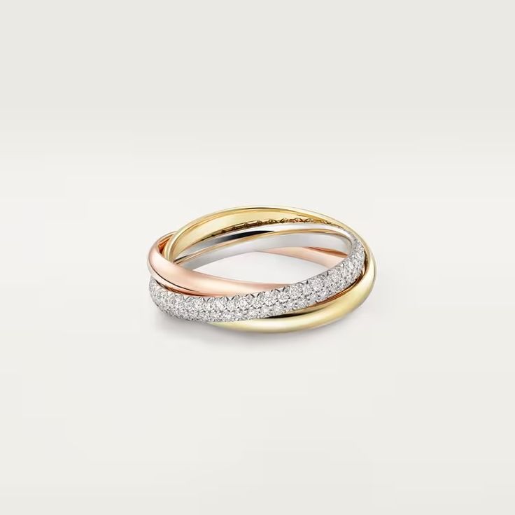 two tone gold and silver ring with diamonds on the inside, set against a white background