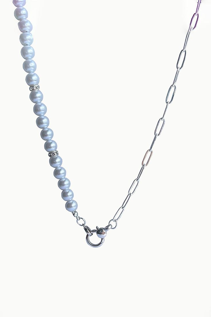 A brand new entry to our summer jewels collection, Mika necklace showcases a strand of lustrous white pearls, silver zircon spacers and sterling silver paperclip chain, elegantly secured with a silver anchor clasp. Pair Mika with delicate pearl earrings to achieve a perfectly coordinated look. White Freshwater Pearls Zircon Studded Silver Spacers Paperclip Chain - Sterling Silver Pearl: Love - Beauty - Wealth Anchor Silver Clasp Pearl Size: 6mm apx. Necklace Length: 20" Silver Pearl Necklace With Chain, Elegant Silver Necklace With Paperclip Chain, Classic Silver Chain Necklace With Pearls, Everyday Silver Pearl Chain Necklace, Elegant White Pearl Necklace With Paperclip Chain, Elegant Silver Pearl Necklace For Everyday, Elegant Everyday Silver Pearl Necklace, Elegant Pearl Necklace With Paperclip Chain, Elegant Pearl Chain Necklace With Silver Chain