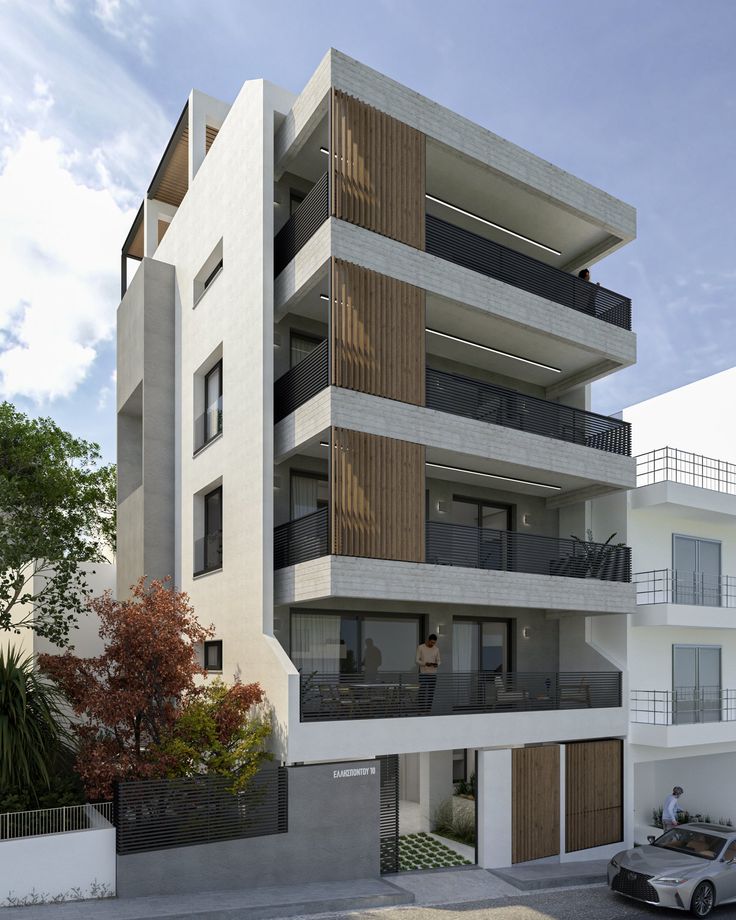 an apartment building with balconies on the top floor and balconies on the second floor