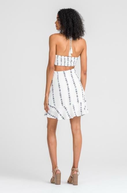 Final Sale - Get it before it's gone! The Lush Light and Day White Cross Front Halter Dress will be there for all of your summertime events! This sexy, geo-embroidered (with navy and dove blue embroidery) white sundress has an adjustable cinched cross-front cutout top (for the perfect fit), with a tassel tie halter bodice. The matching skirt has a ruffle trim. Lined. DETAILS & FIT Body Skimming Fit. Rayon/Poly. Hand wash cold. Imported. Fitted Sundress For Summer Vacation, Fitted Breezy Dresses For Beach Season, Fitted White Beachwear Dress, Breezy Fitted Sundress For Beach, Fitted Breezy Sleeveless Sundress, Fitted Sleeveless Breezy Sundress, Fitted Strapless Sundress For Beach Season, Fitted Sundress For Date Night In Summer, Beach Season Mini Sundress For Date Night