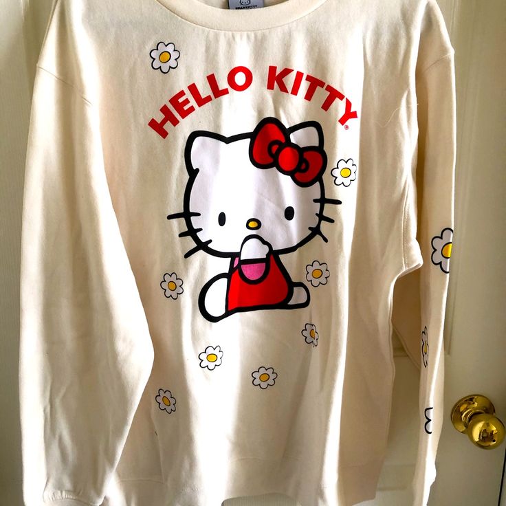 Hello Kitty Sweatshirt Size: M Color: Off White Brand New Without Tag Hello Kitty Cotton Sweatshirt In Kawaii Style, Cute Cotton Sweatshirt With Hello Kitty Print, White T-shirt With Cat Print For Fall, White Cotton Kawaii Sweatshirt, Fall Kawaii Style Cotton Top, Hello Kitty Print Crew Neck Cotton Sweatshirt, Cotton Crew Neck Sweatshirt With Hello Kitty Print, Casual Long Sleeve Hello Kitty T-shirt, Casual Long Sleeve T-shirt With Hello Kitty Print