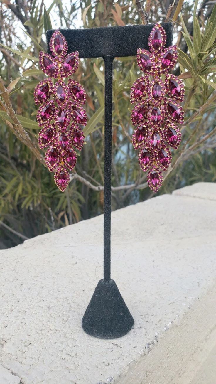 Pink Rhinestone Chandelier Earrings For Party, Pink Chandelier Earrings With Rhinestones For Party, Pink Party Chandelier Earrings With Rhinestones, Pink Long Drop Earrings For Party, Pink Crystal Earrings With Sparkling Stones For Evening, Glamorous Pink Rhinestone Crystal Earrings, Pink Crystal Chandelier Earrings, Glamorous Pink Chandelier Earrings For Evening, Pink Dangle Chandelier Earrings For Evening