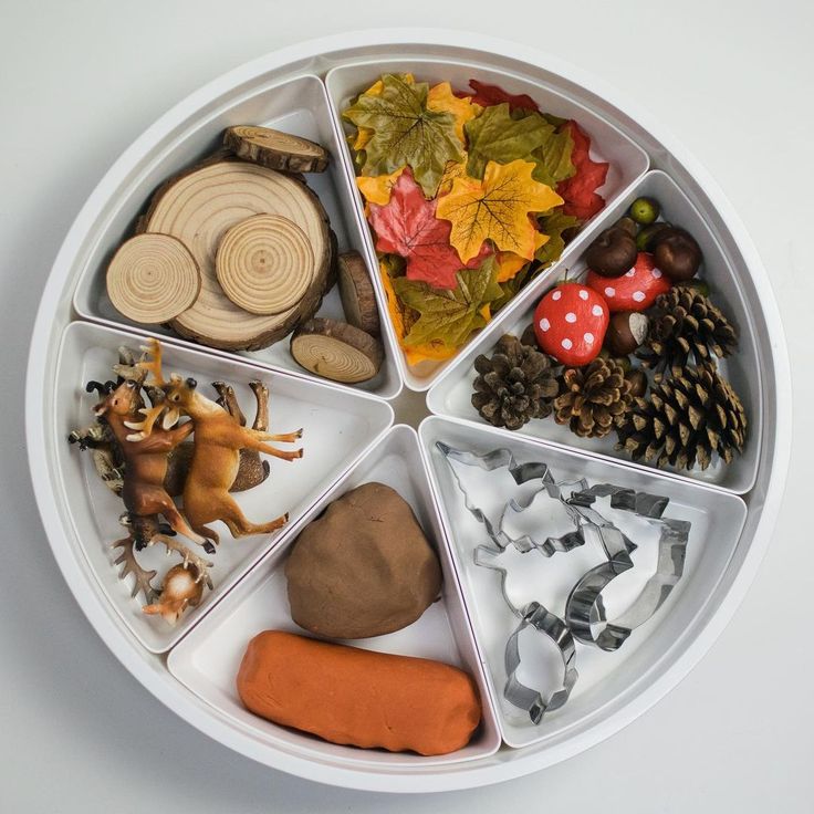 a white plate topped with lots of different types of food and decorations on top of it