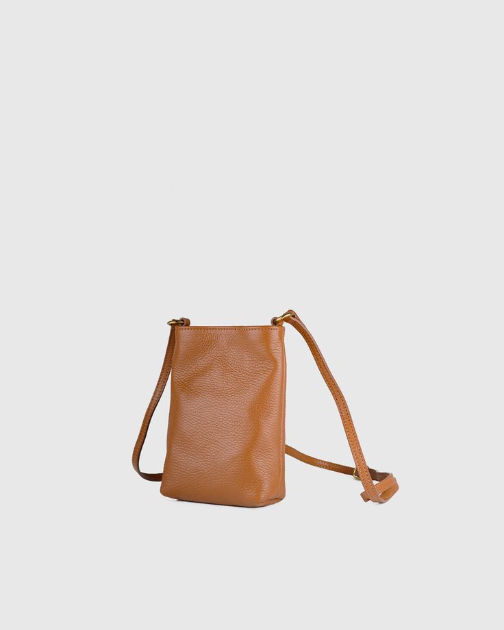 A 21st century much-needed piece, the Phone Crossbody bag is comfortable and perfectly roomy. Adjustable strap, made with a folded feature and lined with pockets for your cards.  | Quince | Women's Italian Pebbled Leather Phone Crossbody in Cognac, Italian Leather Tiny Bag, Linen Tank, European Linens, Phone Pouch, Perfect Gift For Mom, Small Crossbody Bag, Nice Leather, Top Grain Leather, Quince