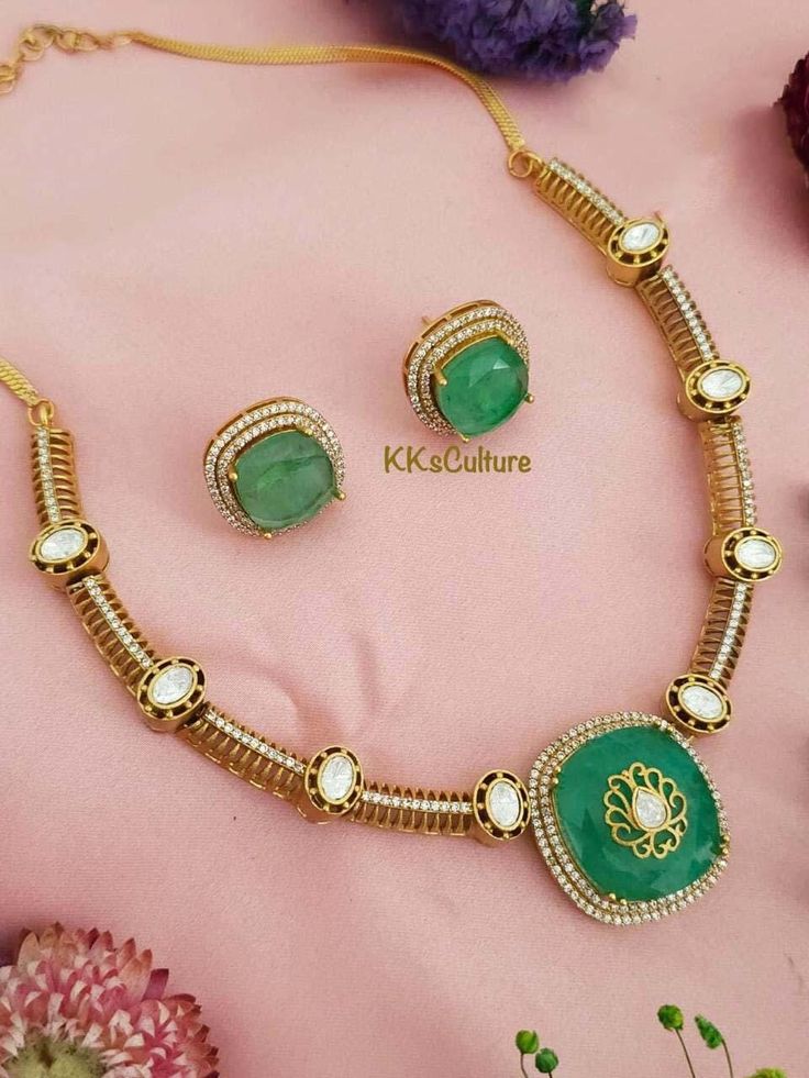 Finish your look with elegance in this timeless jewelry set! Trendy and stylish necklace embedded with Polki Kundan, beautiful gold inlay on mint green doublet stone finished with American diamond detailing. Overall Gold Finishing. Matching earrings included. Speciality chain adjustable. Traditional Look Contemporary Concept!! Exclusively created to add that special touch to your personal event!! ✅Check other styles available in our store https://www.etsy.com/shop/KKsCulture ✅Please check item d Elegant Green Kundan Necklace As Gift, Elegant Green Kundan Necklace Gift, Green Elegant Design Necklace For Gift, Elegant Green Necklace For Gift, Festive Green Necklaces With Elegant Design, Elegant Green Kundan Necklace, Elegant Green Kundan Necklace For Anniversary, Elegant Green Round Kundan Necklace For Anniversary, Green Round Kundan Necklace For Anniversary