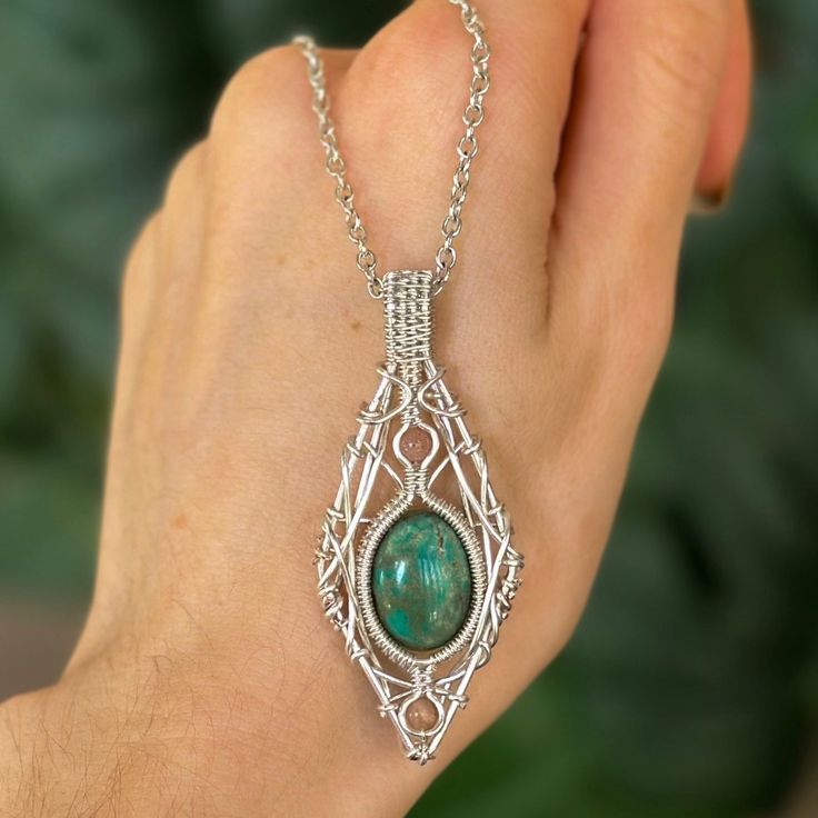 This handmade pendant is wire wrapped with silver plated wire, featuring Nevada Turquoise and Sunstone crystals. Turquoise is a copper aluminum phosphate mineral, its blue color is caused by copper. Turquoise is a stone of balance, and can induce a sense of serenity and peace. This stone is believed to heal the emotional body and relieve stress. Turquoise can teach the wisdom of compassion and forgiveness. Sunstone is an oligioclase feldspar. It is a stone of personal power, freedom, and expande Crystals Turquoise, Emotional Body, Copper Turquoise, Personal Power, The Wisdom, Handmade Pendant, Wire Wrapped Pendant, Handmade Pendants, Nevada