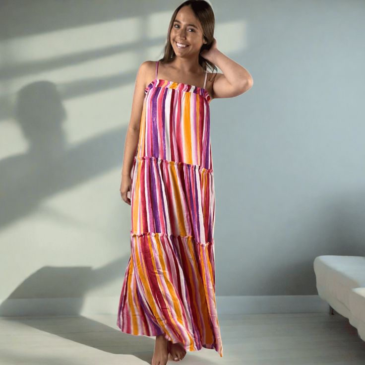 Made in USA Perfect for summer events, our Colorful Beautiful Striped Maxi Sundress will bring many compliments. Made in the USA, this dress features adjustable straps and gentle elastic gathering at the top for a comfortable fit. With a playful ruffle detail and tiered design, vibrant colors in this dress are lavender, coral, pink, orange, and white. Perfect for any summer occasion. Striped Maxi Sun Dress Adjustable Straps Gentle Elastic Gathering at Top Ruffle Detail Tiered Colors in this Dres Multicolor Dress With Tie And Ruffled Straps, Tiered Maxi Dress With Adjustable Straps For Summer, Multicolor Vacation Dresses With Ruffled Straps, Multicolor Dresses With Ruffled Straps For Vacation, Summer Tiered Sundress With Adjustable Straps, Summer Maxi Dress With Ruffled Adjustable Straps, Summer Maxi Dress With Adjustable Ruffled Straps, Multicolor Ruffled Straps Summer Dress, Multicolor Tiered Sundress For The Beach