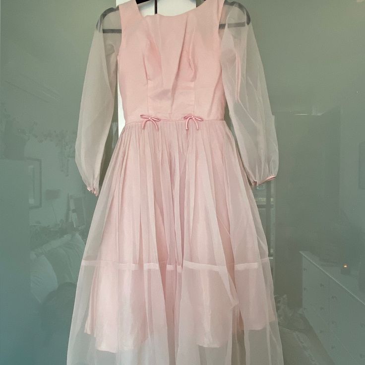 Beautiful Vintage Light Pink Dress. This Is In Fantastic Condition For Its Age. The Sleeves Have A Gorgeous Light Fabric, And The Bows Are Stunning. Pink Formal Dress With Sheer Sleeves, Pink Evening Dresses With Sheer Sleeves, Formal Pink Dress With Sheer Sleeves, Spring A-line Vintage Dress For Cocktail, Spring A-line Vintage Cocktail Dress, Spring Cocktail Vintage A-line Dress, Vintage Summer Dresses With Sheer Sleeves, Summer Vintage Dresses With Sheer Sleeves, Pink Summer Dress With Sheer Sleeves