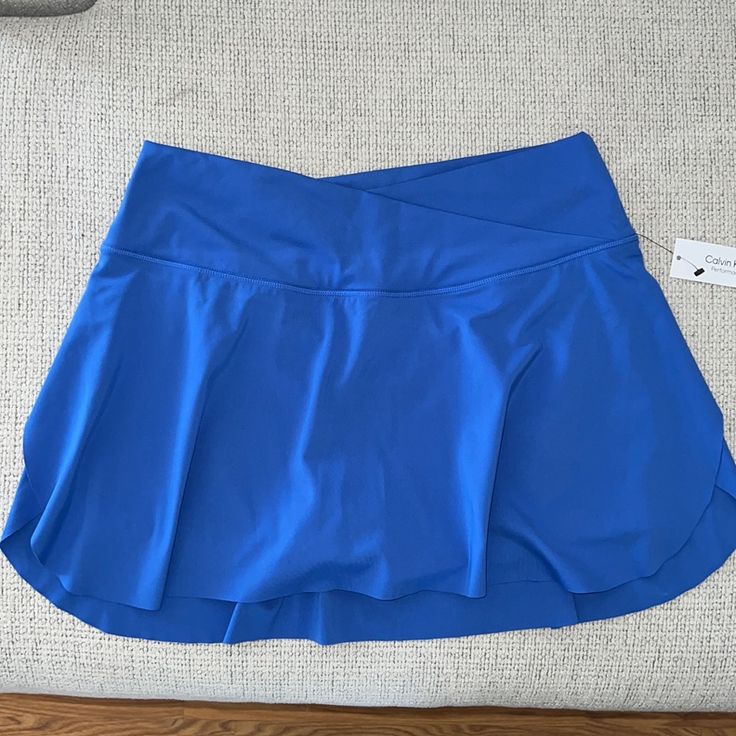 Blue Tennis Skirt Calvin Klein Nwt Great Quality Perfect For Sports Built In Pocket In The Shorts Sporty Blue Skort With Built-in Shorts, Blue Swim Skirt With Built-in Shorts, Blue High Waist Swim Skirt For Spring, High Waist Blue Swim Skirt For Spring, Blue High-waist Swim Skirt For Spring, Blue Sporty Swim Skirt With Built-in Shorts, Fitted Blue Short Swim Skirt, Stretch Blue Pleated Tennis Skirt, Blue Stretch Pleated Tennis Skirt