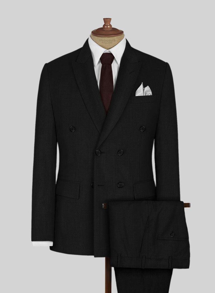 Make a move towards greater freedom, comfort and versatility in our Napolean Black Wool Suit that will also prove to be a stylish choice in your tailoring repertoire. Crafted from wool blend, the wool suit has the right balance of classic and boundary-push. Combine it with a crisp white shirt, plain gray tie and polished black dress shoes.  Look Includes   Napolean Black Wool Fabric  Double Breasted Jacket Style  Peak Lapel   Horn Royal   Black  Buttons  Single Vent  Three Cuff Buttons  Two Welt Double Breasted Suit With Welt Pockets For Semi-formal Events, Black Double-breasted Suit With Concealed Placket, Double-breasted Wool Tuxedo For Work, Double Breasted Business Suit With Concealed Placket, Wool Tuxedo With Double Button Closure, Business Double-breasted Suit With Concealed Placket, Timeless Business Casual Suits With Double Button Closure, Tailored Three-piece Suit With Double Button For Semi-formal, Tailored Three-piece Suit With Double Button For Semi-formal Occasions