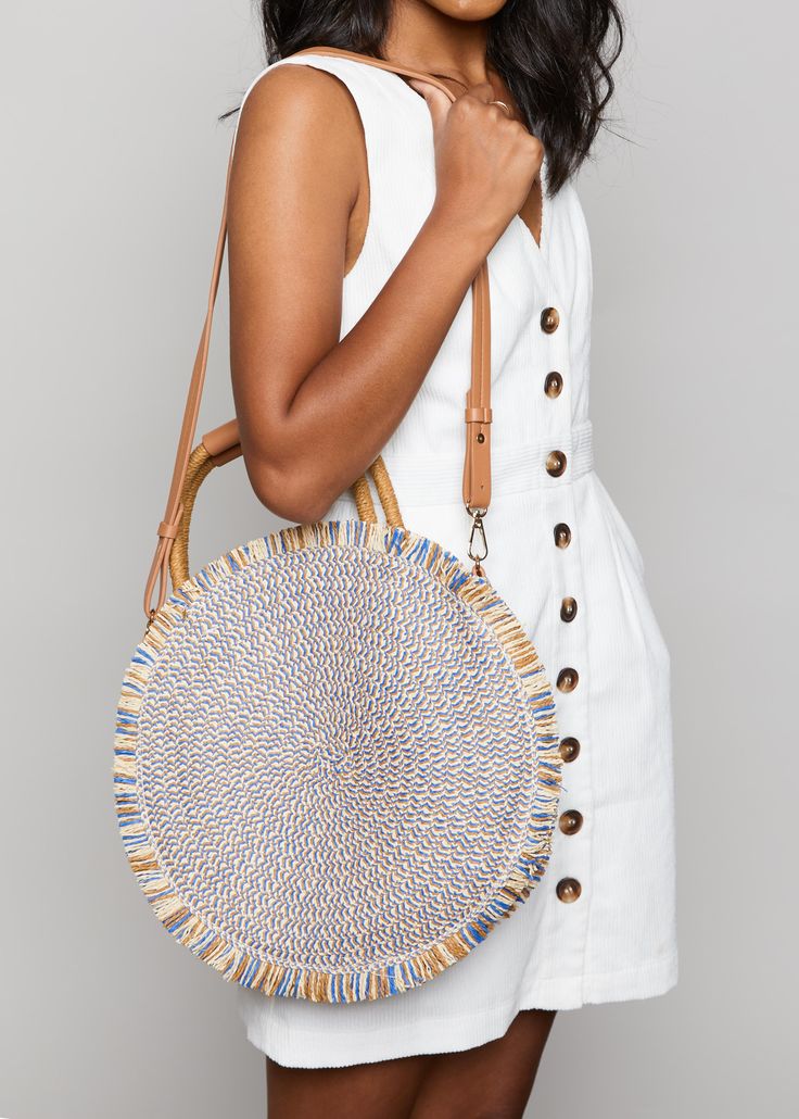 The Season in the Sun Bag is a woven, circular tote that is sure to add some flare to your favorite outfit! Blue like the sea & light as the summer breeze, this tote will keep you getaway-ready all season long! Chic Woven Beach Bag With Round Handle, Spring Woven Shoulder Bag With Round Handle, Trendy Straw Bag With Round Handle For Spring, Chic Braided Straw Bag For Day Out, Chic Spring Beach Bag With Round Handle, Bohemian Shoulder Bag For Summer Outings In Spring, Straw Bag With Round Handle For Beach, Chic Beach Shoulder Bag With Round Handle, Trendy Summer Bags With Round Handle