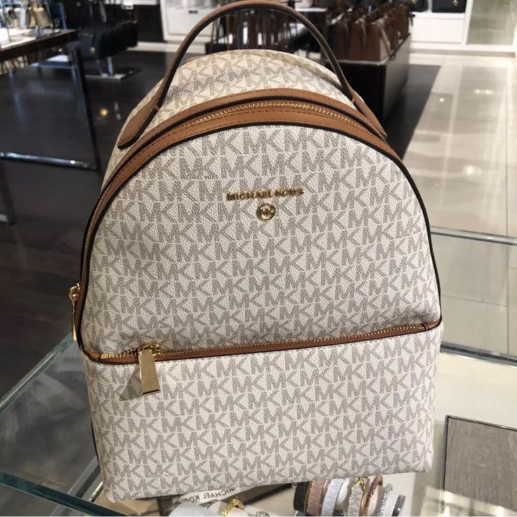 100% Authentic Michael Kors Women Valerie Medium Logo Backpack 9.25"W X 12.5"H X 3.75"D White Standard Backpack For Errands, White Backpack For Errands, White Standard Backpack, White Backpack For Shopping, Luxury White Standard Backpack, White Satchel Backpack For Errands, Michael Kors Beige Backpack For Errands, White Leather Backpack With Dust Bag, White Luxury Backpack With Removable Pouch