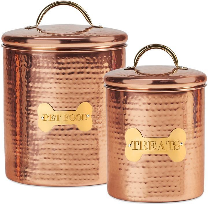 two copper canisters with the words treat on them